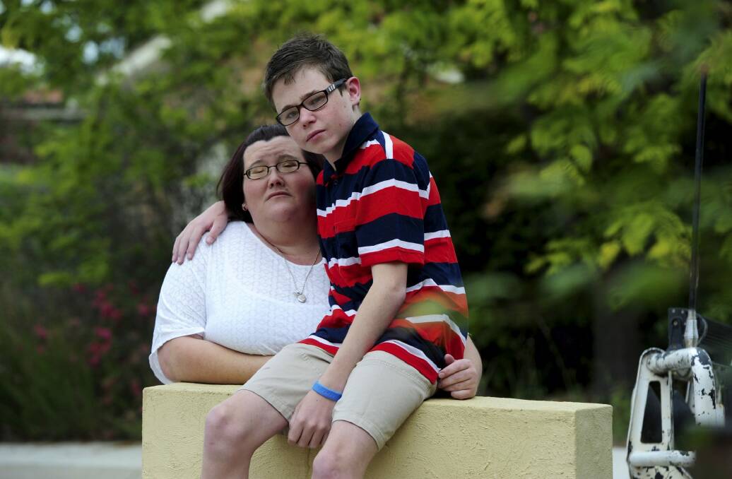 Danielle McMahon, of Ngunnawal, at her home with her 13-year-old
autistic son Jay. Photo: Graham Tidy