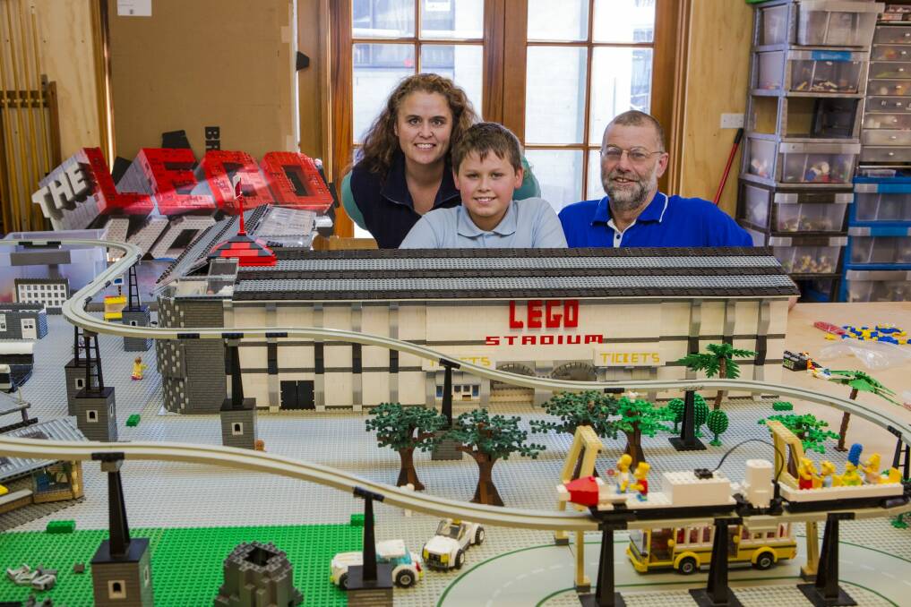 Mel Bezear, Anthony McLauchlan, and their son Oliver McLauchlan, 10, with some of the Lego that will be on display for the Brick Expo. Photo: Jamila Toderas