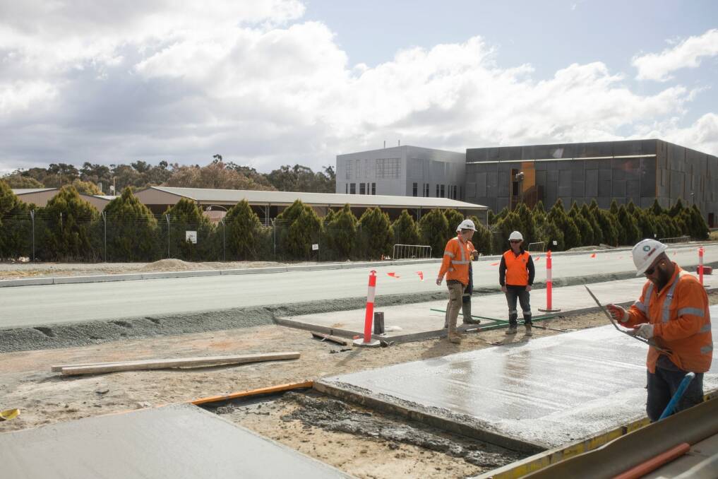 Workers laying track slab on the Gungahlin stretch of Canberra's light rail.  Photo: Jamila Toderas