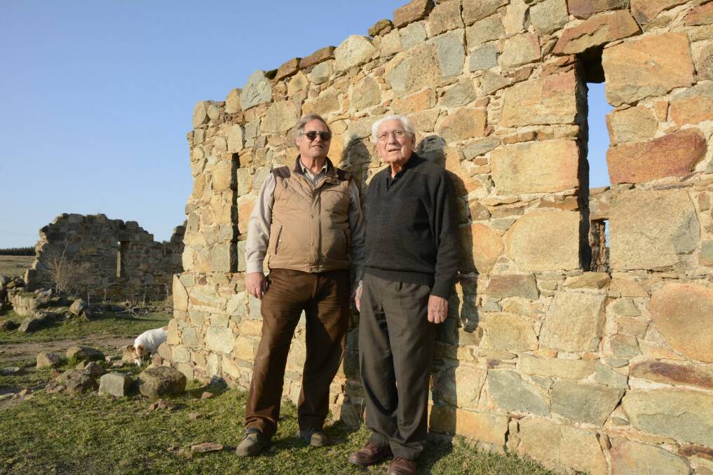 Lawrie Nock (left) and Keith Brown and his dog Rusty at the mystery fort. Photo: Tim the Yowie Man)