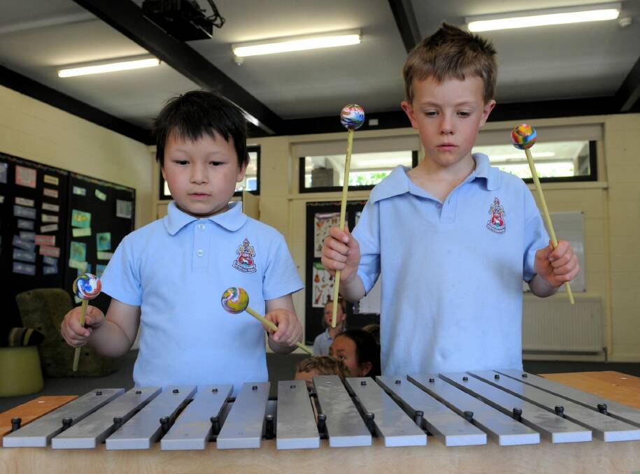 Students William Carroll and Alec Bell perform at Canberra Grammar School's southside campus. Photo: Graham Tidy