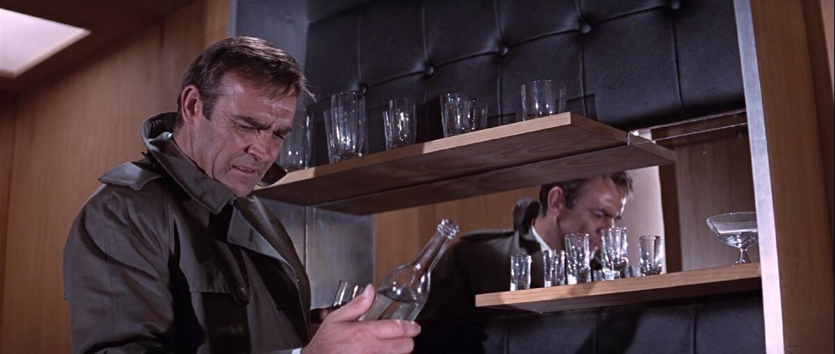 Sean Connery's James Bond looks with distaste at what he calls "Siamese vodka" in You Only Live Twice.