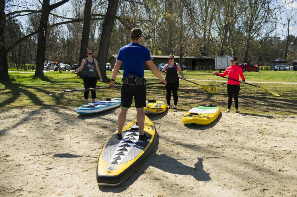 Hard core: Stand-up paddle board fans rave about the core workout it gives them.