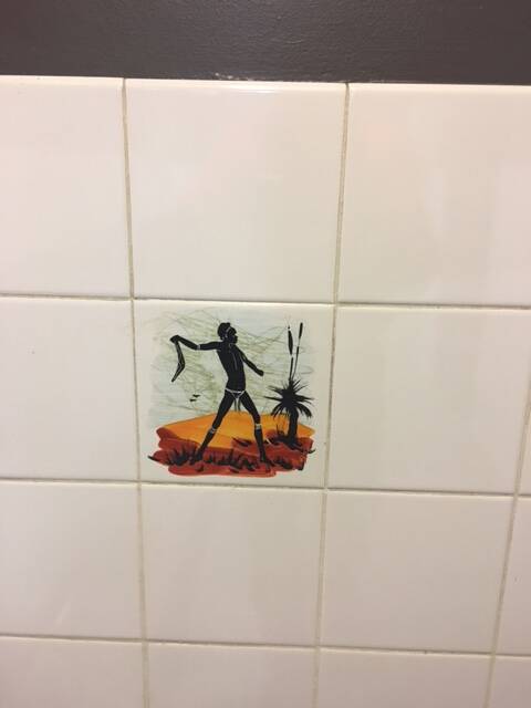 A photograph supplied by ACT Labor politician Bec Cody showing one of the tiles in the  men's urinal at the Sussex Inlet RSL, which she says is a disgrace. Photo: Supplied