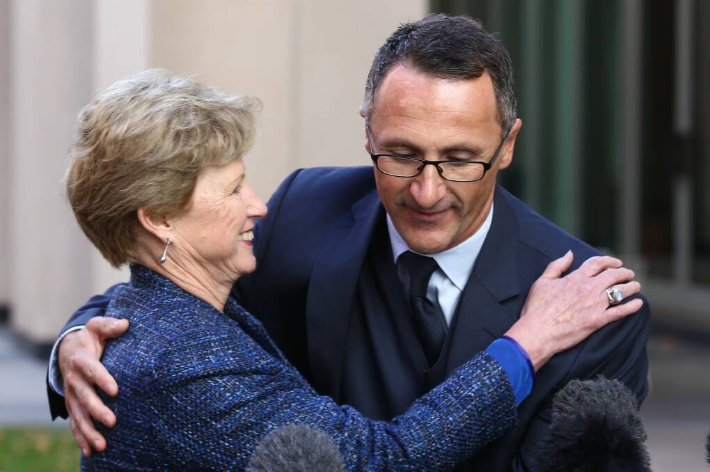 Quick handover: Former Greens leader Christine Milne and new Greens leader Richard Di Natale on Wednesday. Photo: Andrew Meares