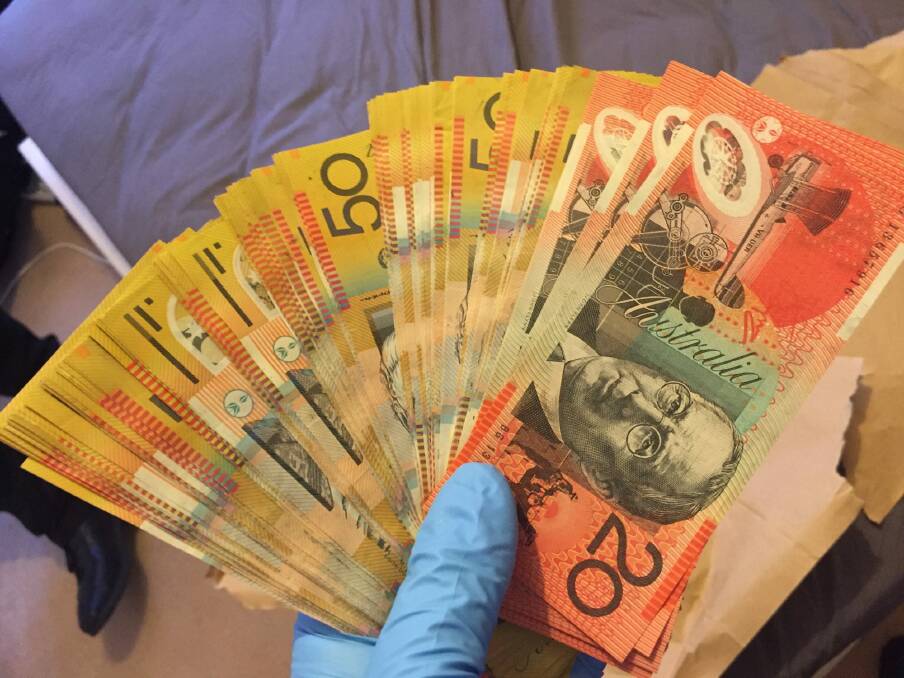 Cash seized by police at the Banks home, allegedly the proceeds of crime. Photo: ACT Policing