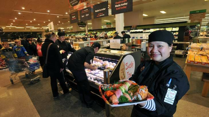 A sushi bar called "Sushi Izu", has opened in the Woolworths supermarket at Cooleman Court, Weston Creek. Manager, Christina Ho, with a tray of freshly made sushi. Photo: Graham Tidy