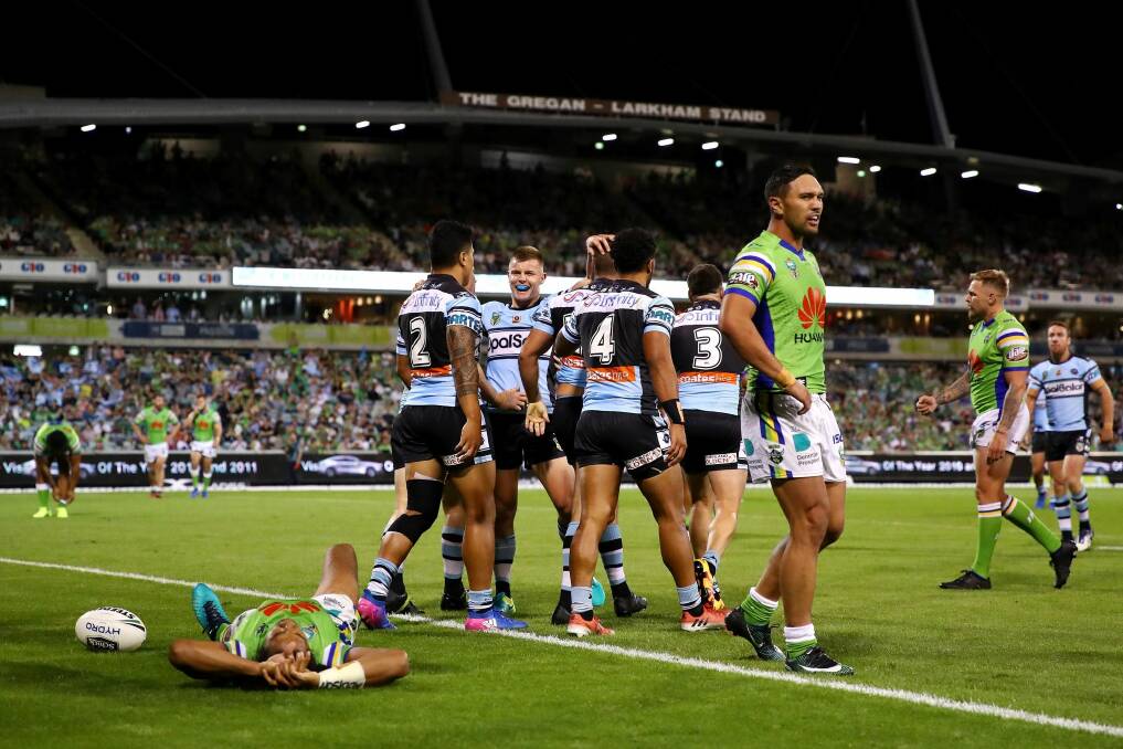 Wade Graham of the Sharks celebrates scoring a try with team mates. Photo: Getty Images