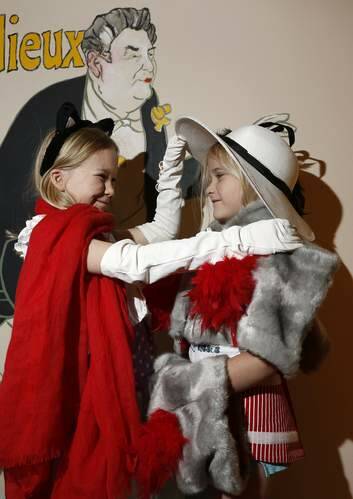 Alexandra Loney, 8, with sister Anna Loneg, 5, from Amaroo dress up in the Toulouse Lautrec Family Activity Room. Photo: Jeffrey Chan