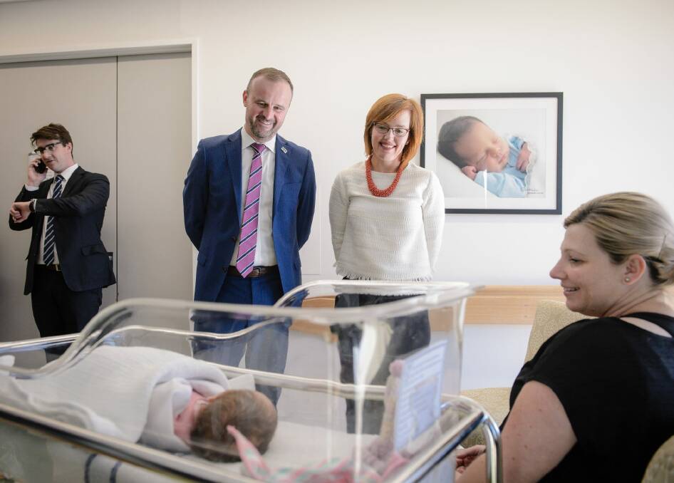ACT Chief Minister Andrew Barr and Health Minister Meegan Fitzharris meet Anita Linforth and baby Eden on Thursday. Photo: Sitthixay Ditthavong