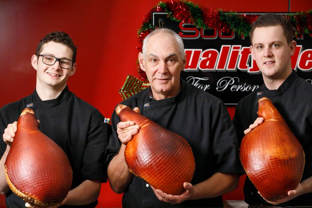 Callum Hogan, Alan Matthews and Reece Travers from Southlands Quality Meats with some Christmas hams. Photo: Sitthixay Ditthavong