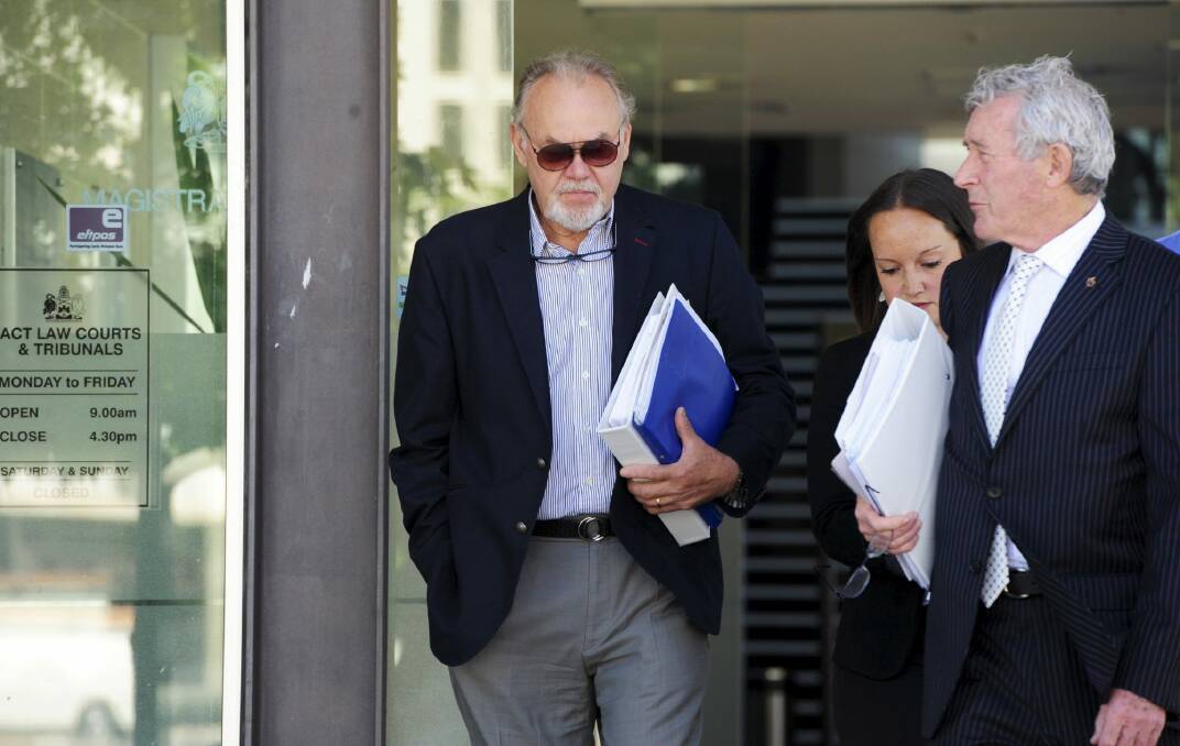 Vytautas (Vytas) Kapociunas, left, leaves court with his barrister Bernard Collaery earlier this year. Photo: Graham Tidy