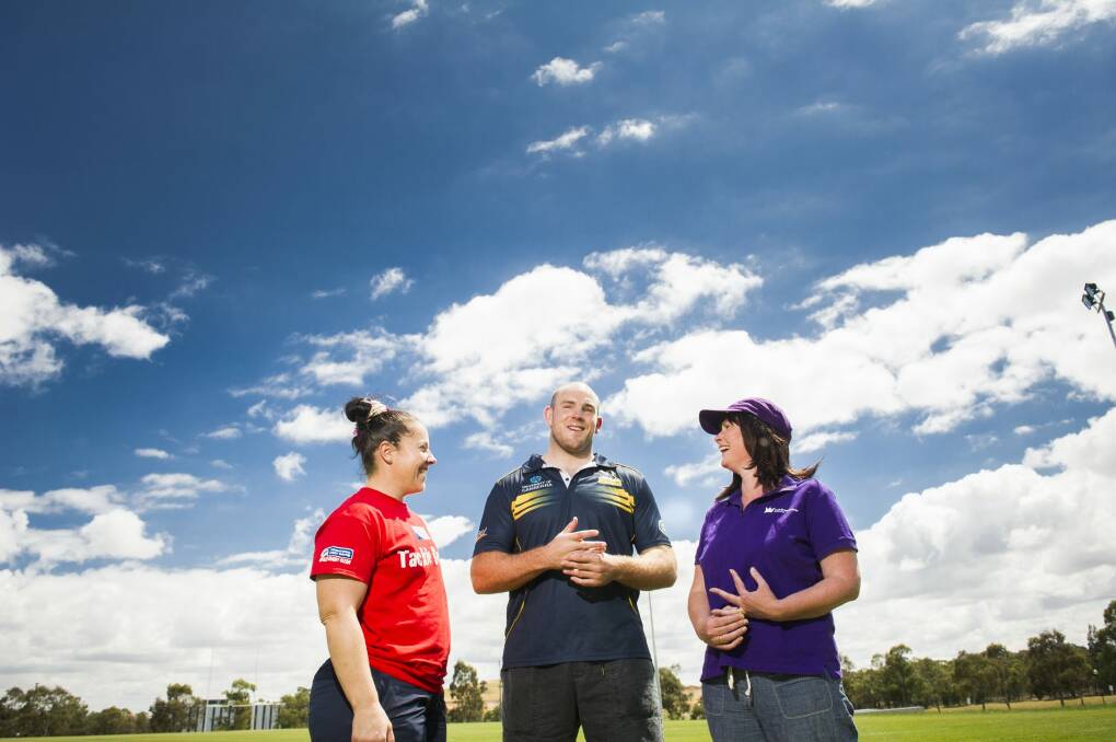 Raising awareness: Brain cancer survivor Sarah Mamalai (wearing purple) with Wallaroo Louise Burrows and Wallaby captain and Brumby Stephen Moore ahead of the Walk4Brain Cancer event on Sunday.   Photo: Rohan Thomson