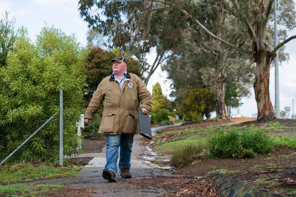 First-time Liberal candidate Paul Sweeney door knocking in Holt. Photo: Jay Cronan