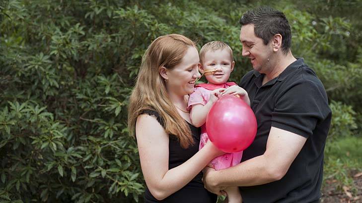 Fighting spirit: Indie Rose with parents Jen Smith and Jai Taurima . Photo: Supplied