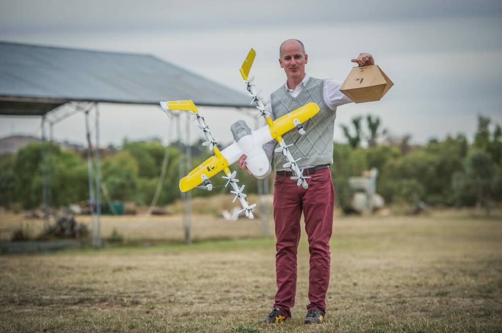 Project Wing has been developing a technology drone delivery service for Tuggeranong, delivering hot meals and chemist supplies. Delivery project manager Luke Barrington takes delivery of a hot lunch from Guzman Y Gomez.  Photo: karleen minney