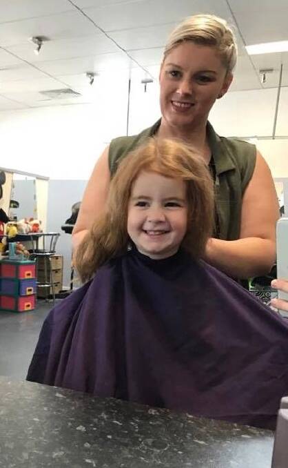 Canberra hairdresser Nicole McDonald with Ava Wright, three. Nicole is giving free hair cuts to all red heads on March 3. Photo: Supplied