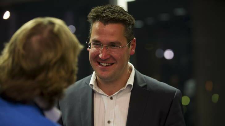 Zed Seselja talks with supporters at the Liberal party at the Hotel Realm on election night. Photo: Rohan Thomson