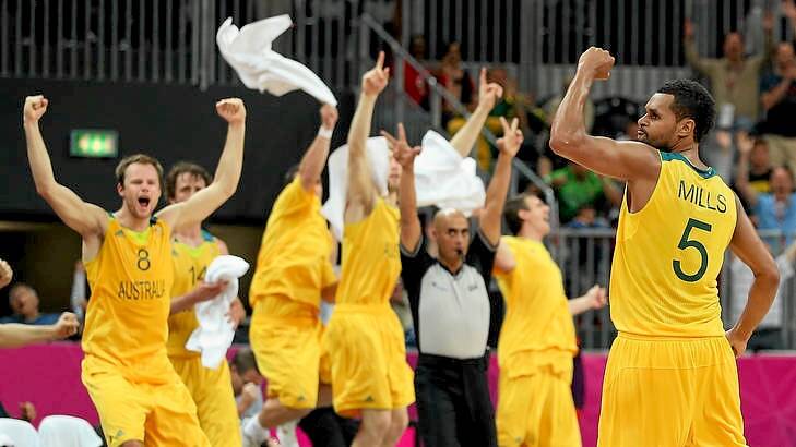Patrick Mills of Australia celebrates after making the game-winning three point shot against Russia in the final seconds of the Men's Basketball Preliminary Round match at the London Olympics. Photo: Getty Images