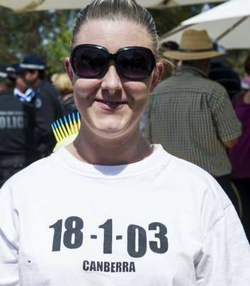 Respect ... Johanna Hauritz wears a t-shirt in tribute to those who helped to fight the fires in January 2003. Photo: Rohan Thomson