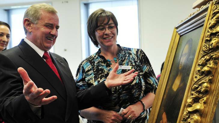 Arts Minister Simon Crean and manager of preservation Jennifer Lloyd inspect a copy of the famous painting the Mona Lisa by Leonardo da Vinci at the National Library. Photo: Jay Cronan