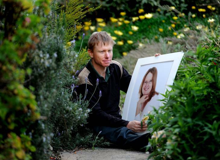 Craig holds a photo of his partner Emily who committed suicide in 2009. Photo: Melissa Adams