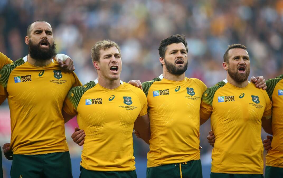 Went off injured: Matt Giteau, right, pictured singing the national anthem at the start of the match with try-scoring hero Adam Ashley-Cooper. Photo: Getty Images
