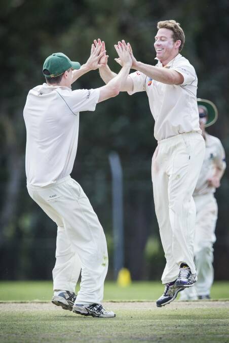 Adam Heading celebrates a wicket in Weston Creek Molonglo's clash with and ANU at Stirling Oval. Photo: Matt Bedford