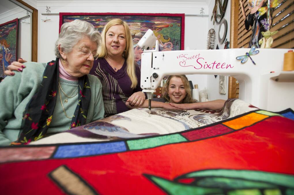 Three generations of quilters: 16-year-old Ineka Voigt, her mum Helen Godden and her grandmother Pat Godden. The trio will all be entering quilts in this year's Canberra Craft and Quilt fair.  Photo: Jay Cronan