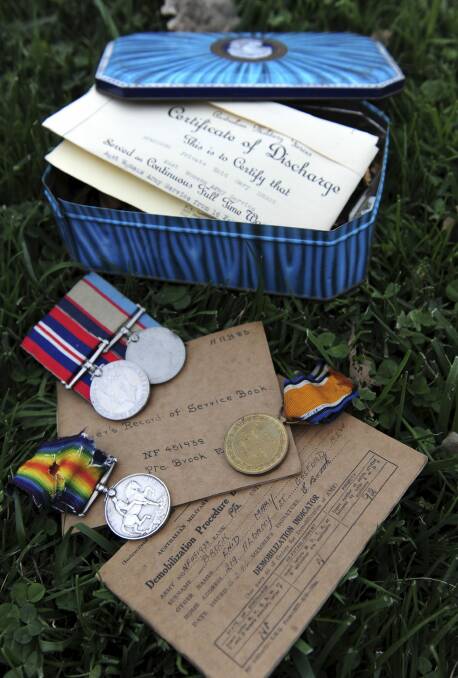 Allison Forbes-Rodgers, from Brisbane, was reunited with these medals and documents that belonged to her mother and grandfather, retrieved from the Green Shed. Photo: Graham Tidy