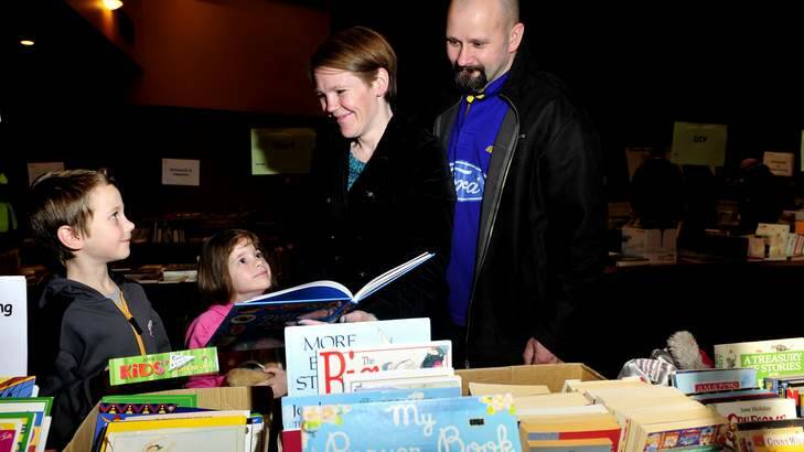 The Crichton family of Theodore. Jodie and Paul with their children Connor, 7 (left) and Charli, 5, attend the bookfair at the Vikings Auditorium for the first time. Photo: Melissa Adams