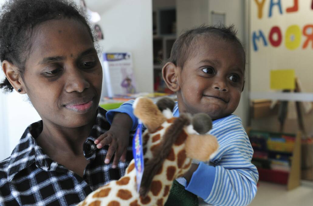Charlie Rao, 22 months, from the Solomon Islands, with his mother Mary Ribe, before his life-changing surgery at The Canberra Hospital. Photo: Graham Tidy