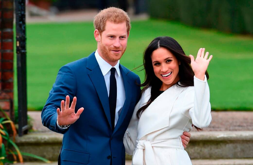 Britain's Prince Harry and Meghan Markle pose for the media at Kensington Palace in London.  They will be married later this month. Photo: EDDIE MULHOLLAND