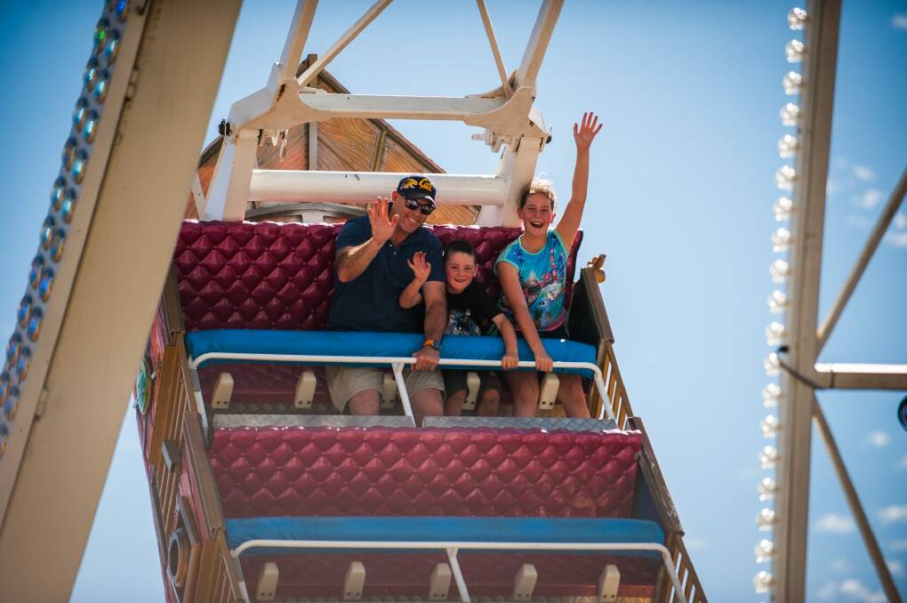 Shane Leslie with his kids Cooper, 6, and Brooklyn,  11, enjoying the new Pirate Ship ride. Photo: Elesa Kurtz