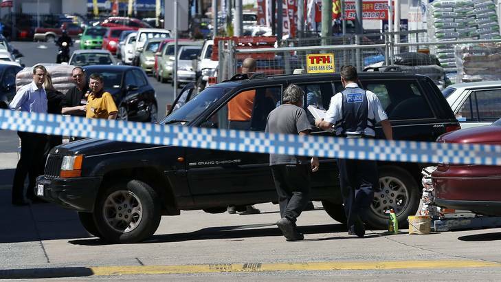 Police at the scene of a accident at the Woden Magnet Mart carpark where a pedestrian was hit, and eventually died, in October 2012. Photo: Jeffrey Chan