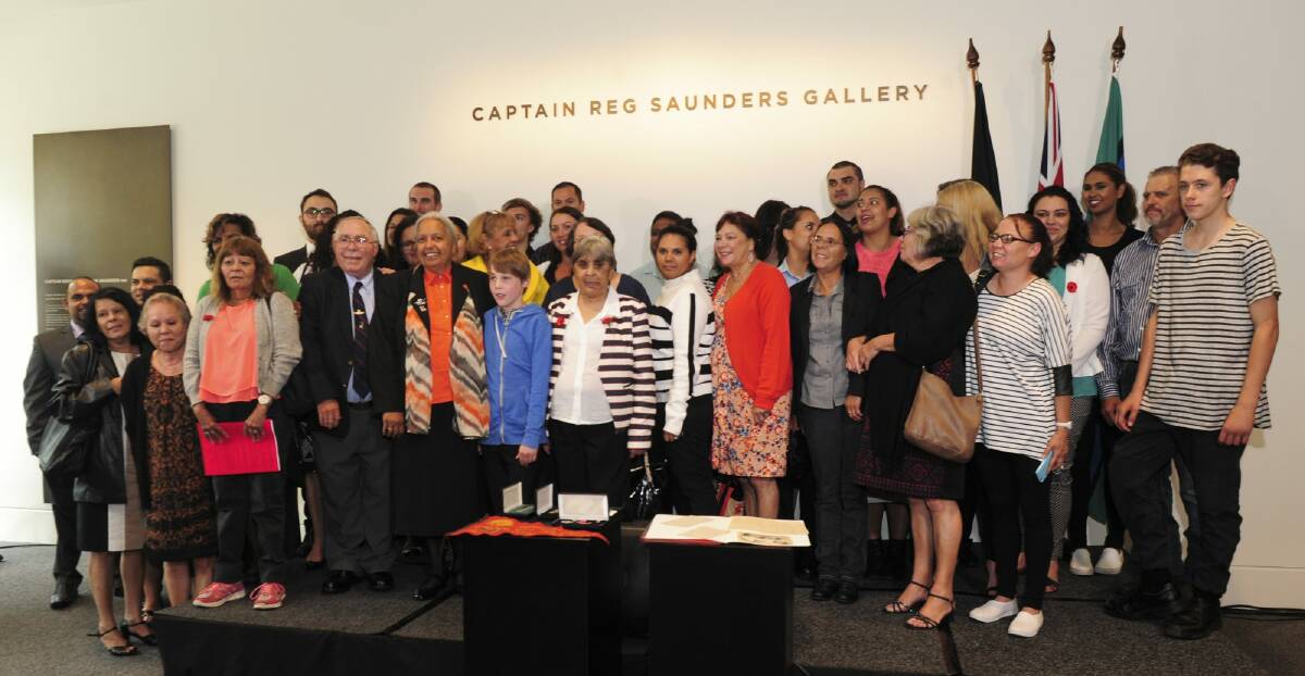 Relatives of Reg Saunders inside the Captain Reg Saunders Gallery.
 Photo: Graham Tidy
