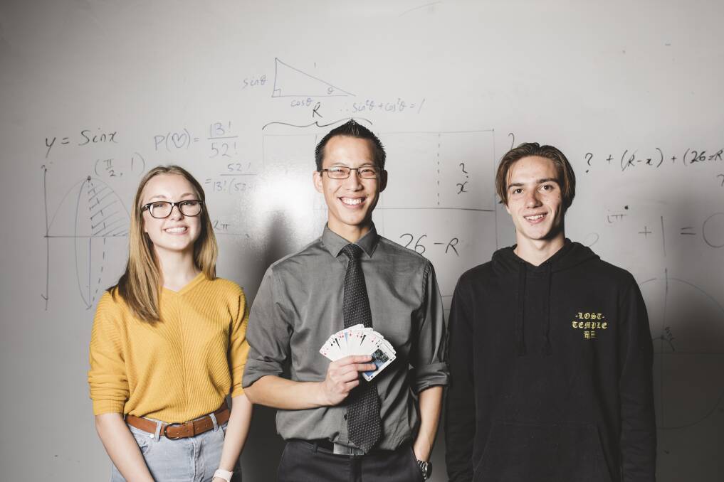 Eddie Woo visits Hawker College to run a maths session with a group of students, including Diana Morton 16 (left), and Hulieo Anderson 17 (right). Photo: Jamila Toderas