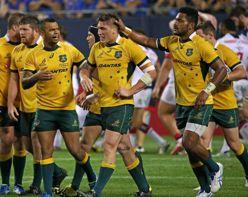 Well done: Sean McMahon is congratulated by teammates after scoring a try against the USA Eagles during the Wallabies' win at Soldier Field in Chicago. Photo: Getty Images