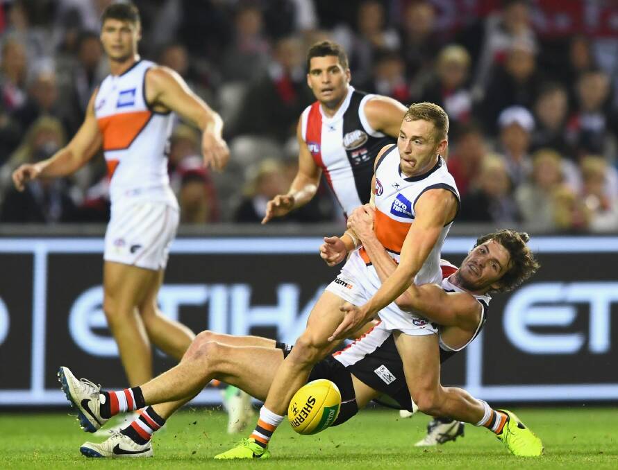 Sidelined: Devon Smith is tackled by Dylan Roberton of the Saints. Photo: Getty Images
