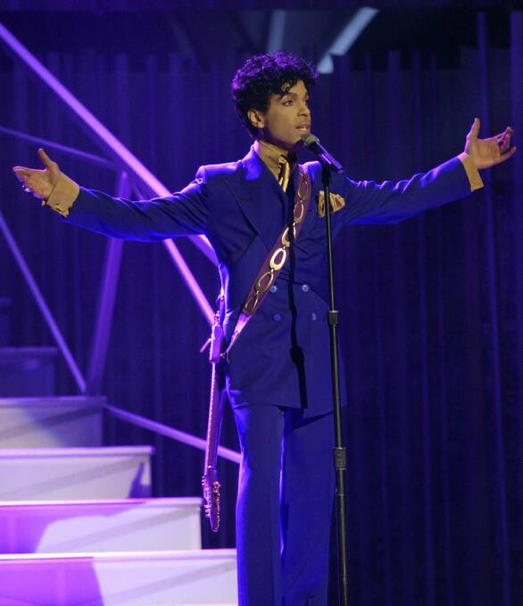 Prince performs during the 46th Annual Grammy Awards in Los Angeles Photo: AP