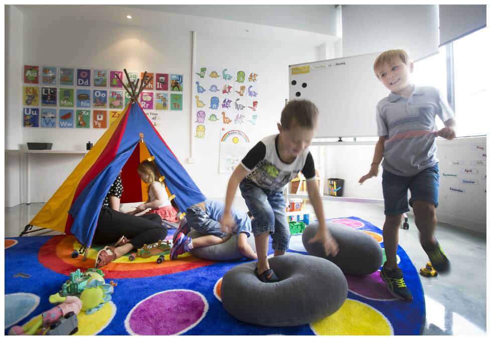 Bailey and Jack test their balancing skills on a soft cushion with other children who all attend a new preparatory school program for children with autism. The Little School is the first of it's kind in Australia. Photo: Simon O'Dwyer