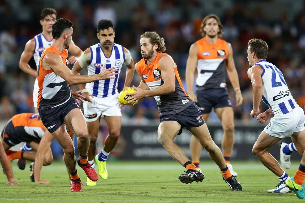 Callan Ward of the Giants looks upfield to attack during the JLT Community Series AFL match in which Greater Western Sydney defeated North Melbourne in Canberra. Photo: Getty Images