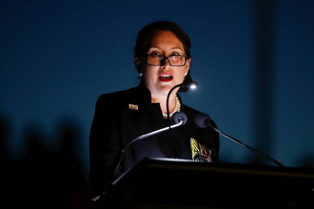 Retired Colonel Susan Neuhaus delivers the address during the Anzac Day dawn service at the Australian War Memorial in Canberra. Photo: Alex Ellinghausen