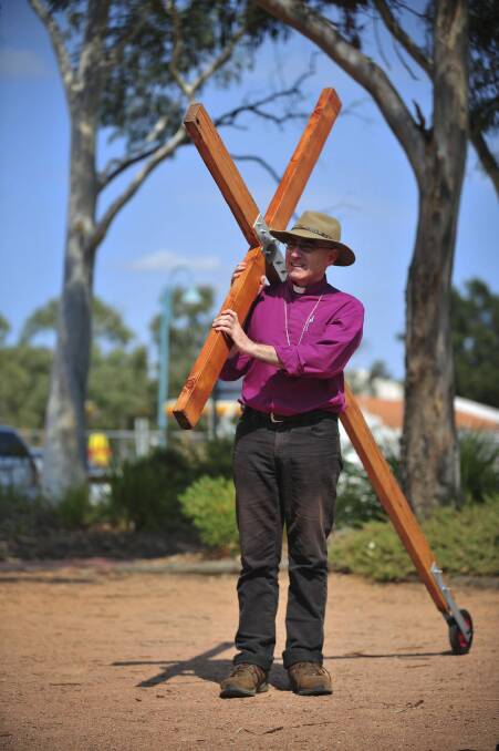 Bishop Stuart Robinson did a six-week long walk with a 2 metre cross starting in Eden and arriving in Canberra on Easter Saturday in 2013. Photo: Katherine Griffiths