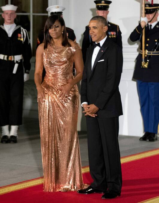 Michelle Obama in a gown designed by Atelier Versace for the Italy state dinner in October. Photo: AP