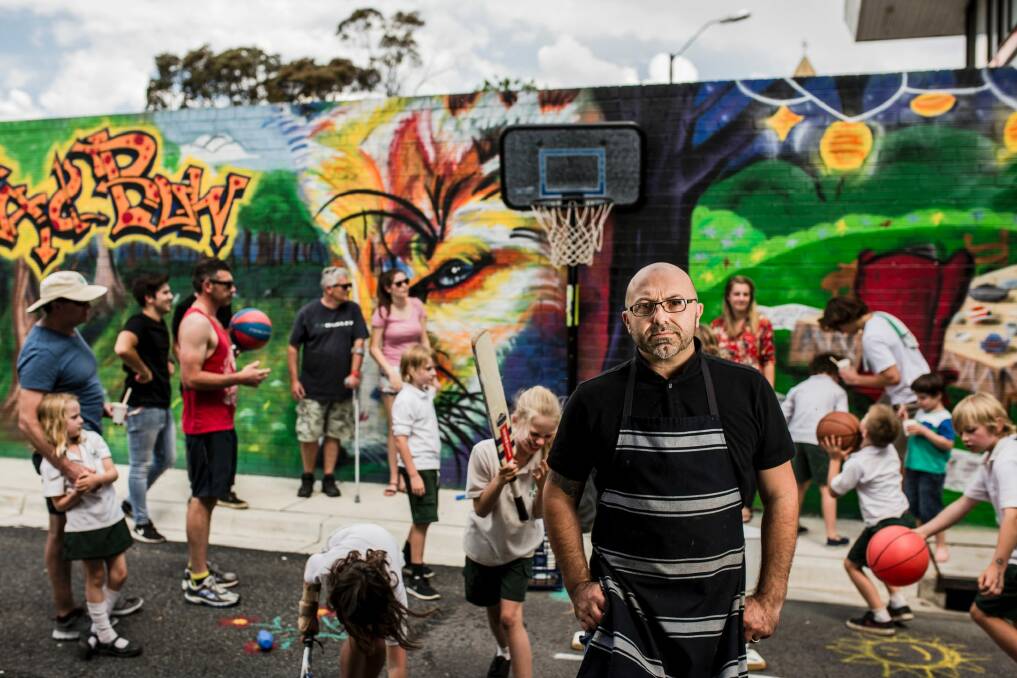 Alex Piris who is the owner of Fox and Bow Cafe, at Farrer, is unhappy about the ACT government asking him to remove the cafe's basketball hoop. Photo: Jamila Toderas