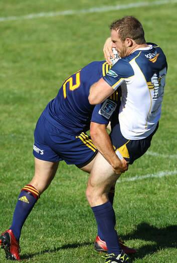 Pat McCabe cops a heavy tackle against the Highlanders. Photo: Getty Images