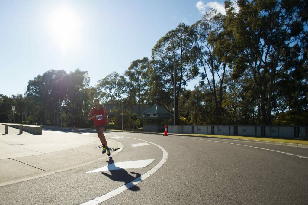 At Parliament House during the Canberra Times fun run on Sunday, with only the spring morning for company in the heart of the race. Photo: Jay Cronan