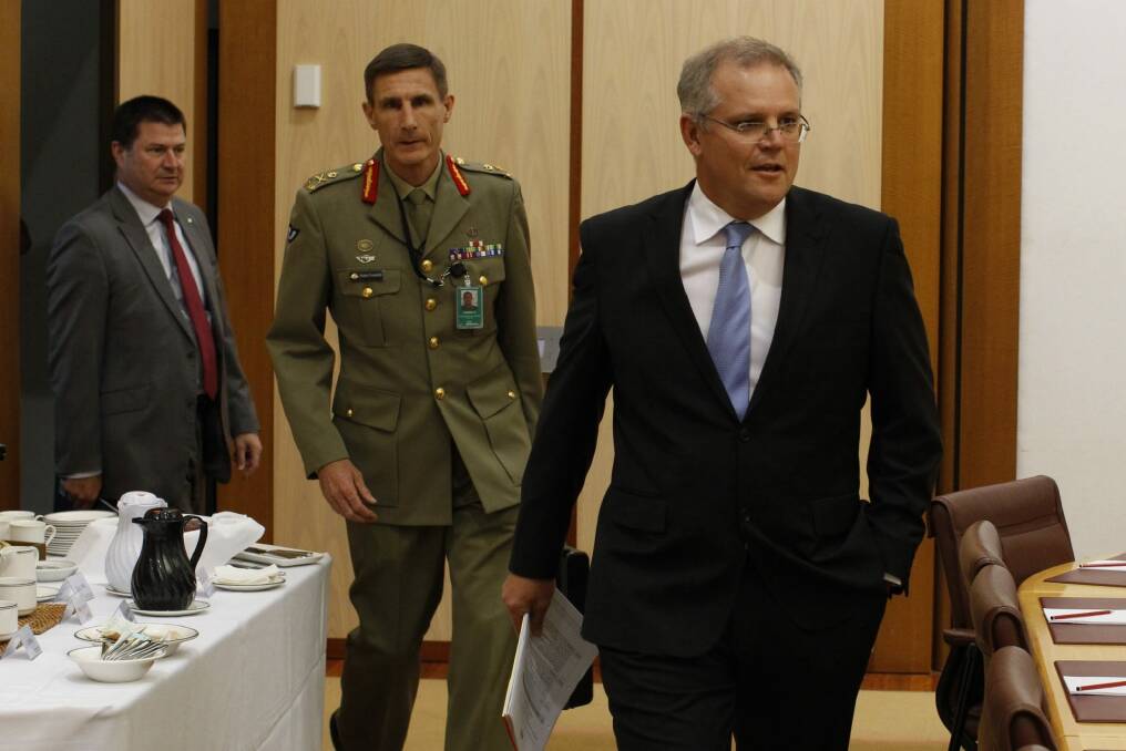 Martin Bowles with then immigration minister Scott Morrison and Lieutenant General Angus Campbell in 2014. Photo: Andrew Meares