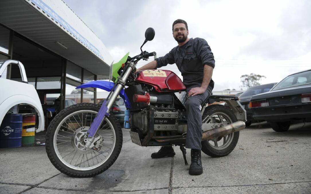 35 year old auto electrician Tim Kiernan of Wanniassa is entering his 1985 BMW K100 motorcycle in the Scrapheap Adventure Ride in September to raise money for Down Syndrome NSW. Photo: Graham Tidy.